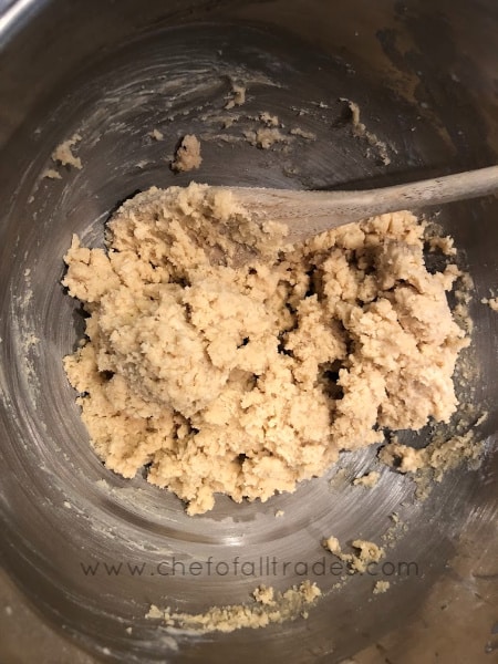 The World's Greatest Chocolate Chip Cookie dough in mixer bowl with flour added
