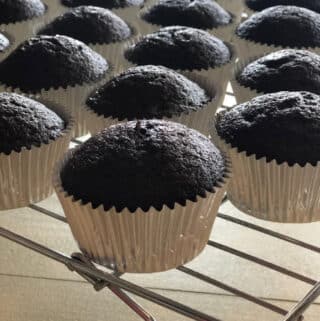 chocolate cupcakes cooling on a wire rack