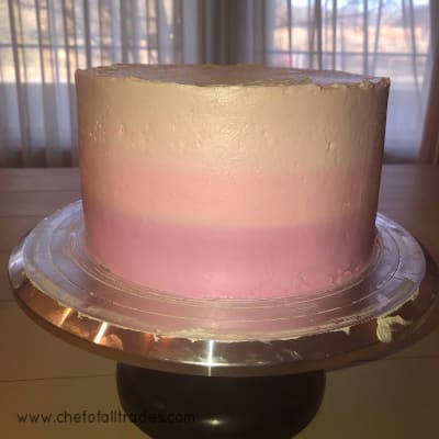 buttercream smoothed on the sides of a cake