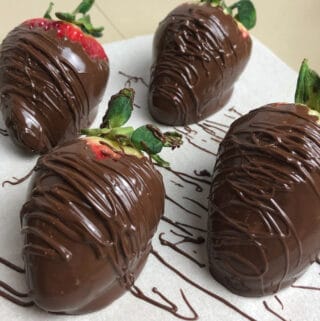 Chocolate Covered Strawberries Decorated on parchment paper