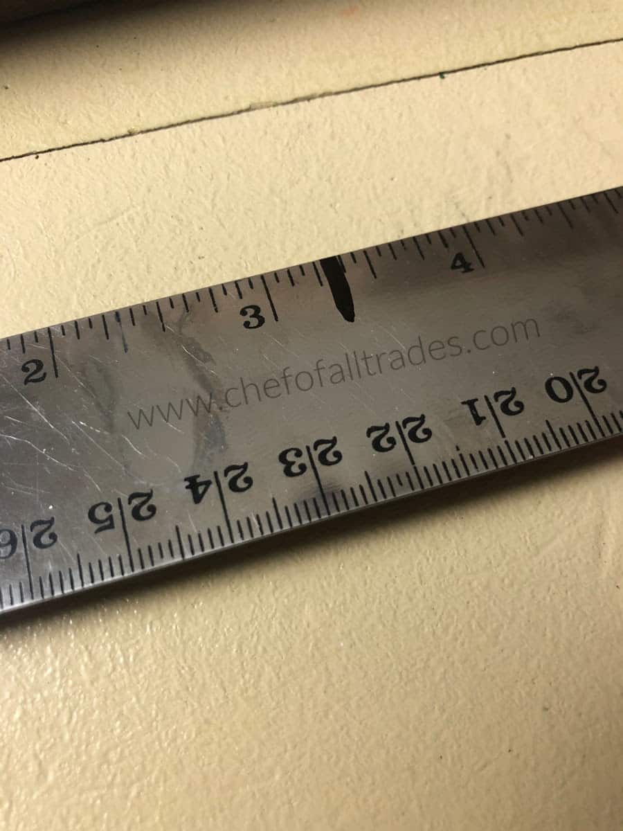 mark on ruler at the 1/2 way measurement 