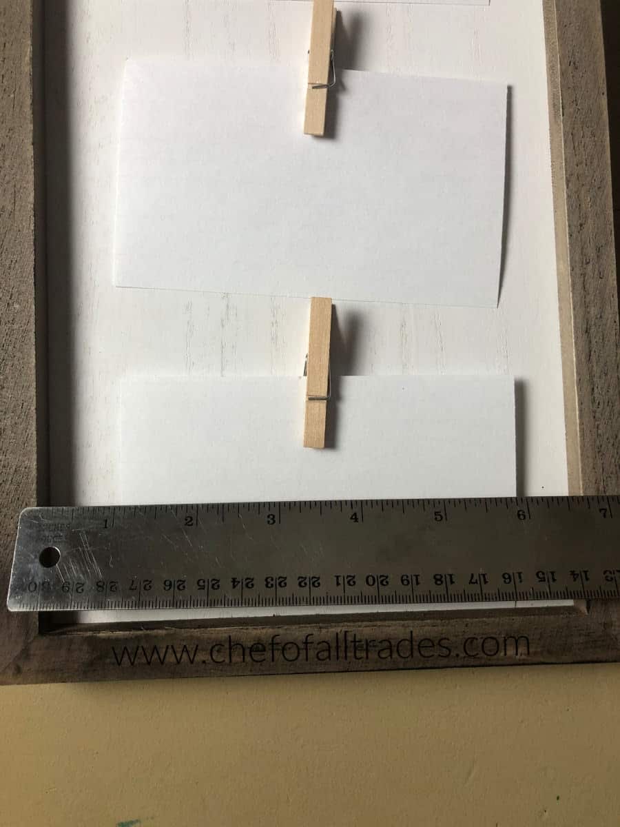 ruler on top of menu board to measure width