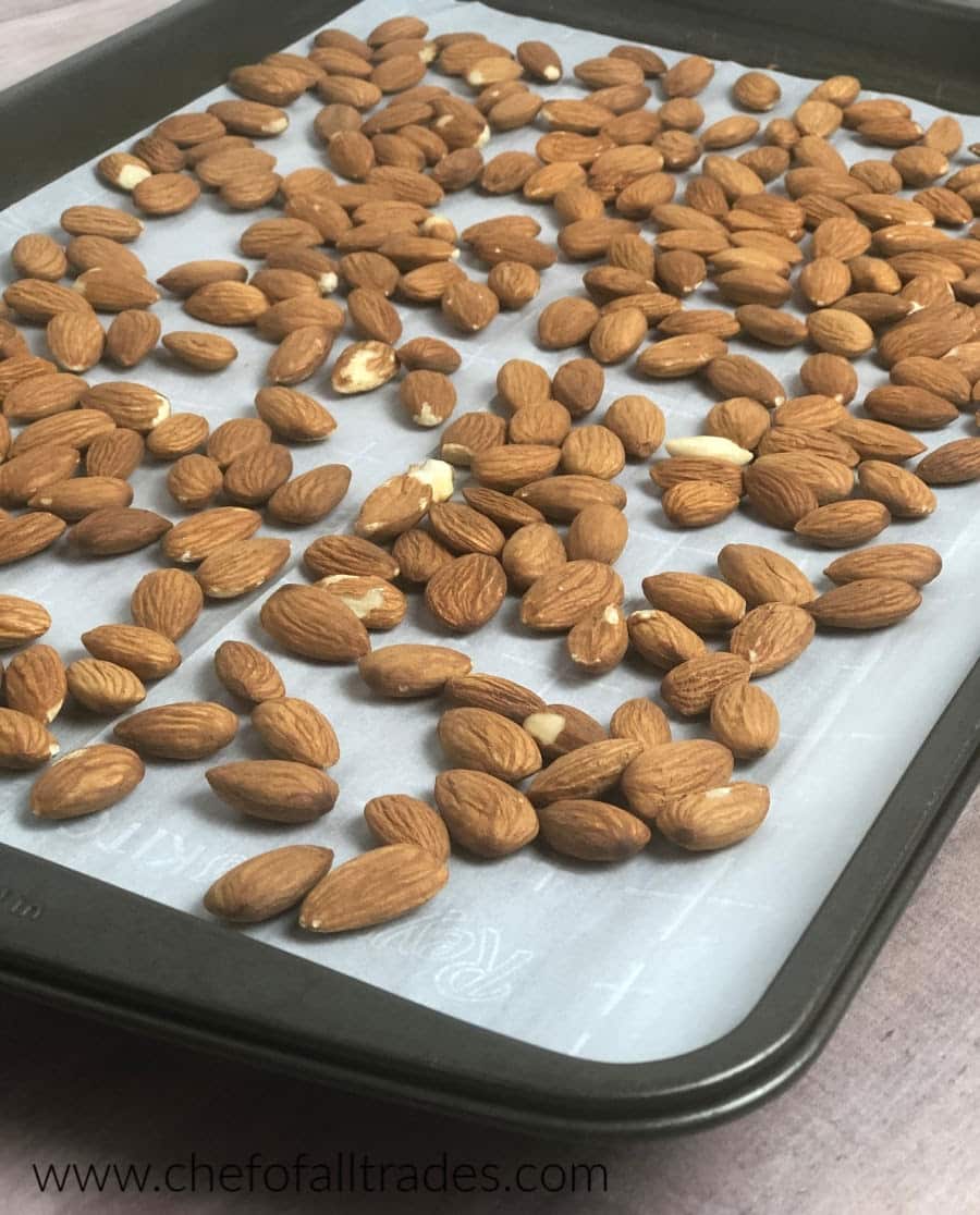 toasted almonds on a parchment lined cookie sheet