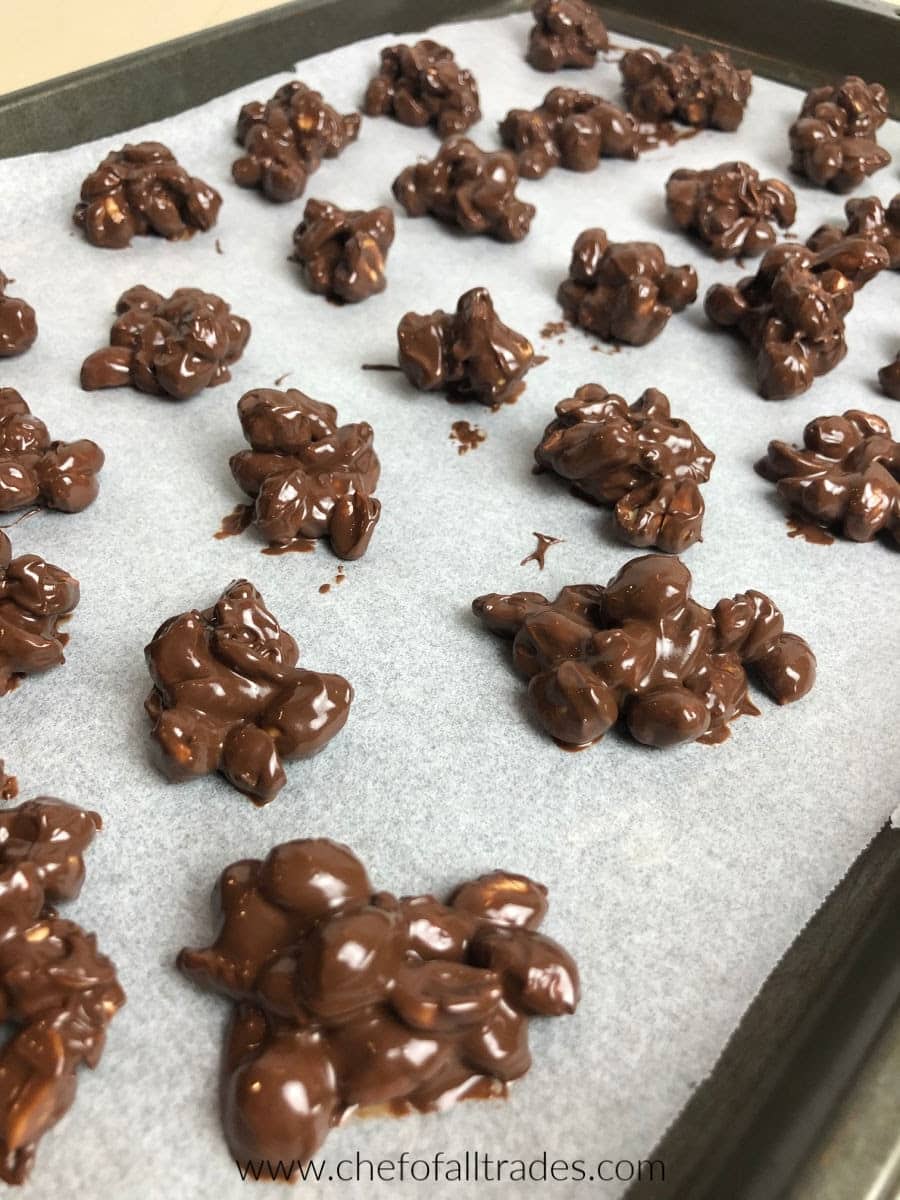 peanut clusters on a parchment lined cookie sheet