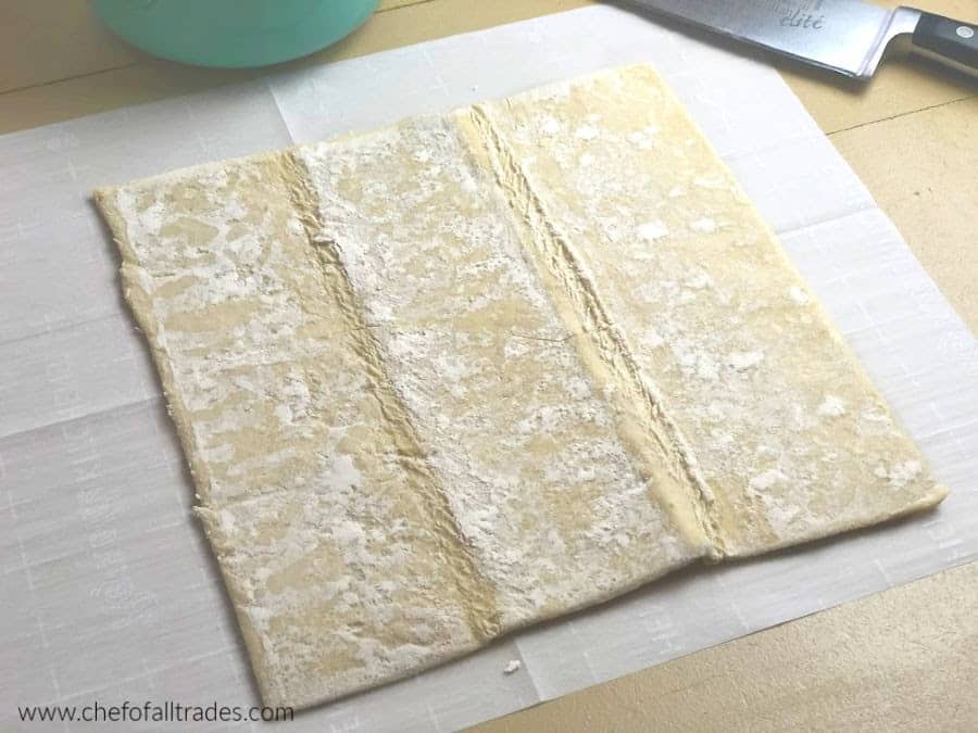 Puff Pastry laying on a sheet of parchment paper