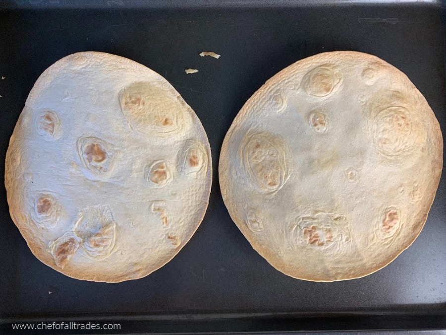 toasted tortillas on a baking sheet