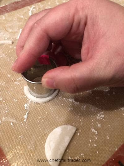 cutting eye shapes out of gum paste with a round cookie cutter.