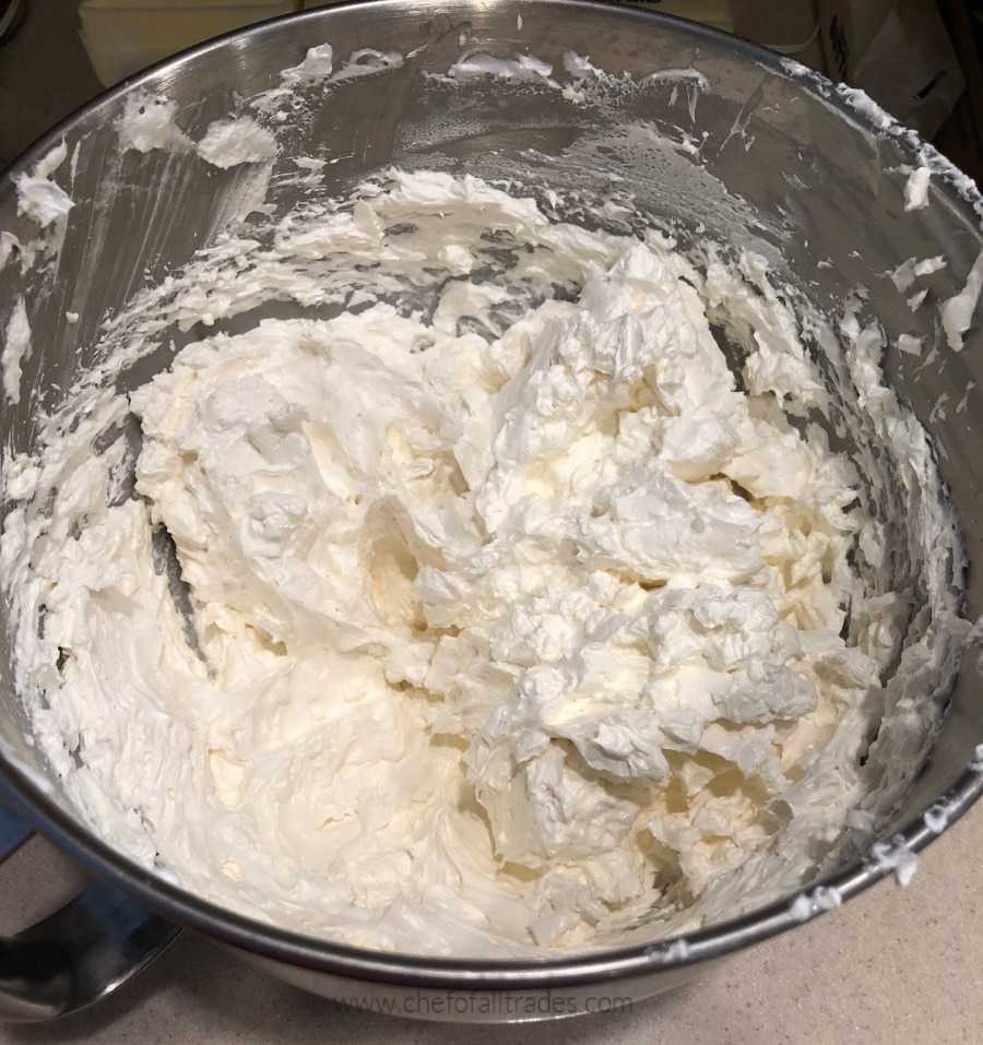 buttercream in a stainless steel mixing bowl