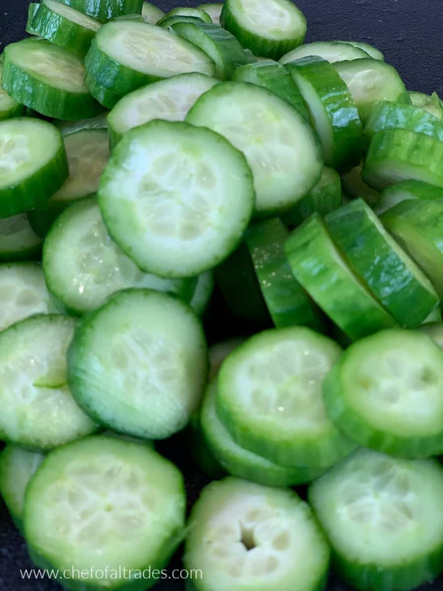 sliced cucumbers on a cutting board