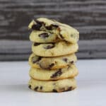 Gluten-Free Sugar-Free Chocolate Chip Cookies stacked on a while table