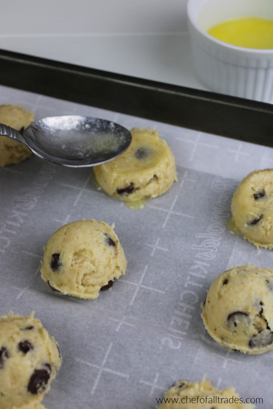 smashing the cookies down slightly with the back of a spoon that was dipped in melted butter