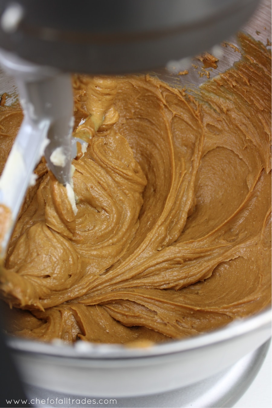 peanut butter added to butter mixture in a mixing bowl