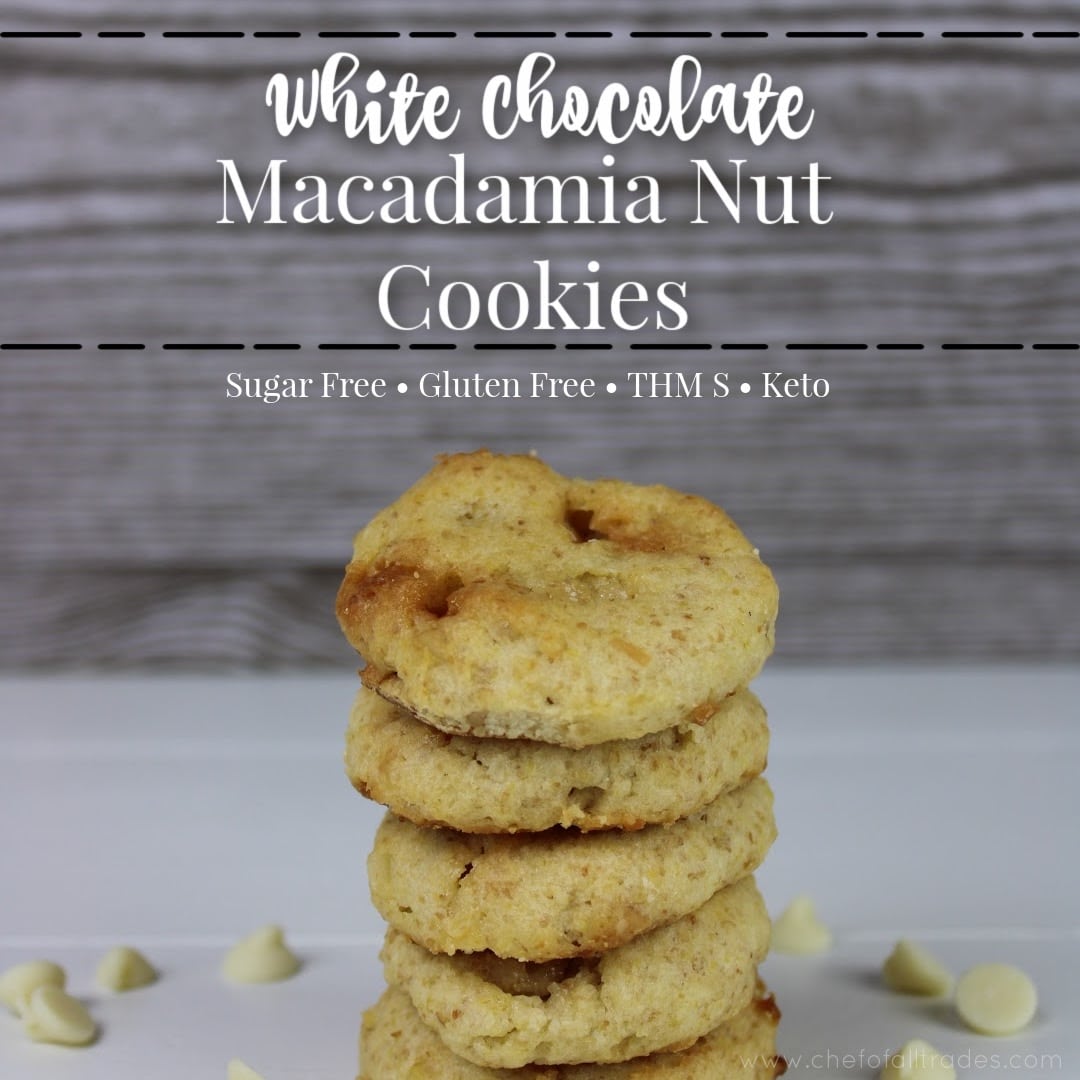 White Chocolate Macadamia Nut Cookies stacked on a white table with white chocolate chips surrounding the stack of cookies