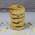 White Chocolate Macadamia Nut Cookies stacked on a white table