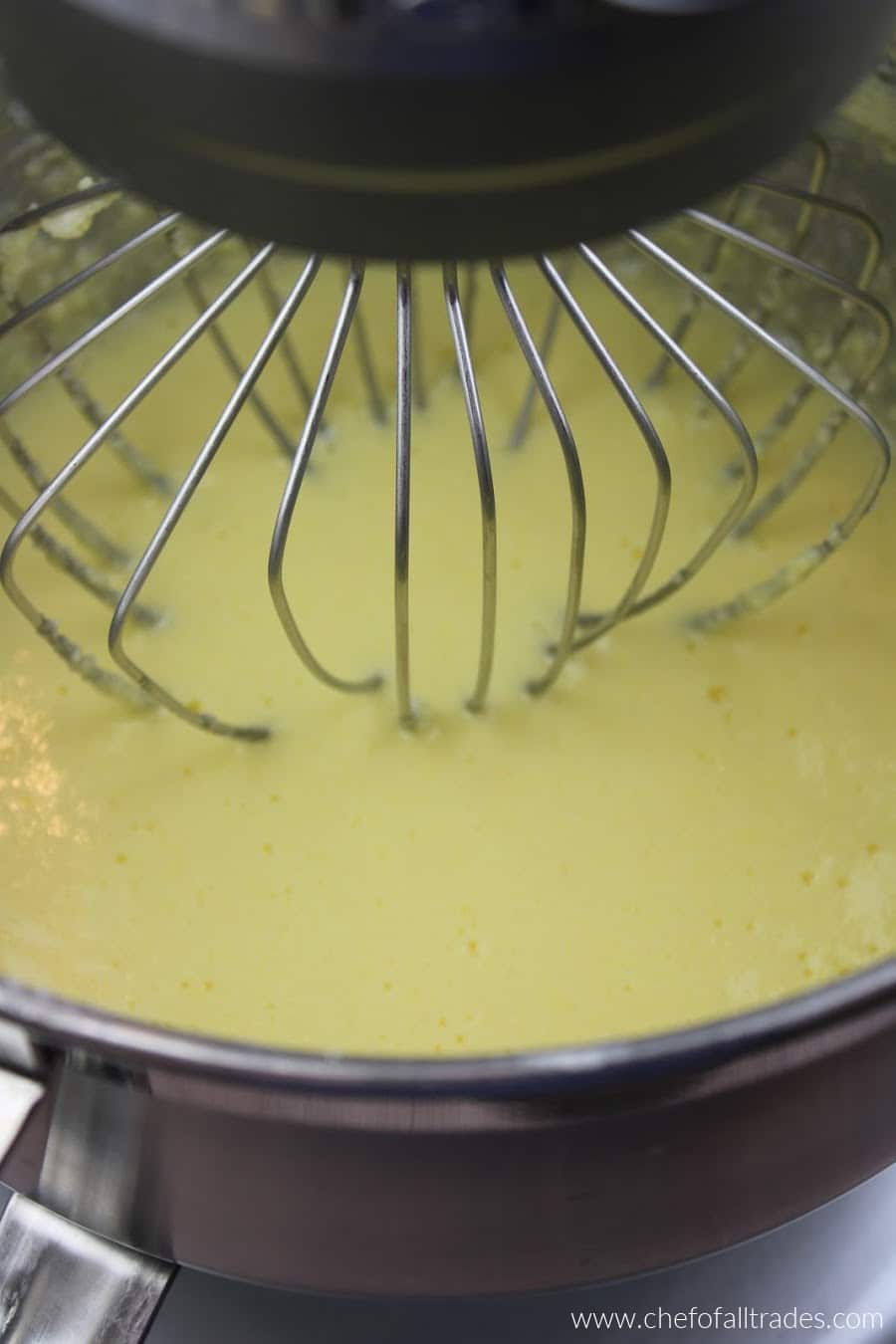 eggs being mixed into the gentle sweet and butter mixture