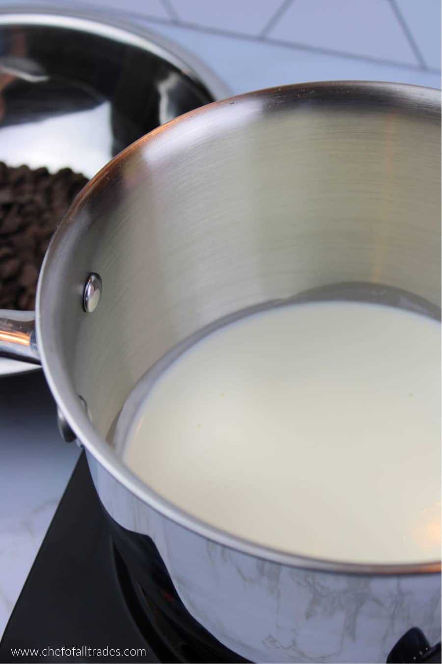 heavy cream heating in a pot