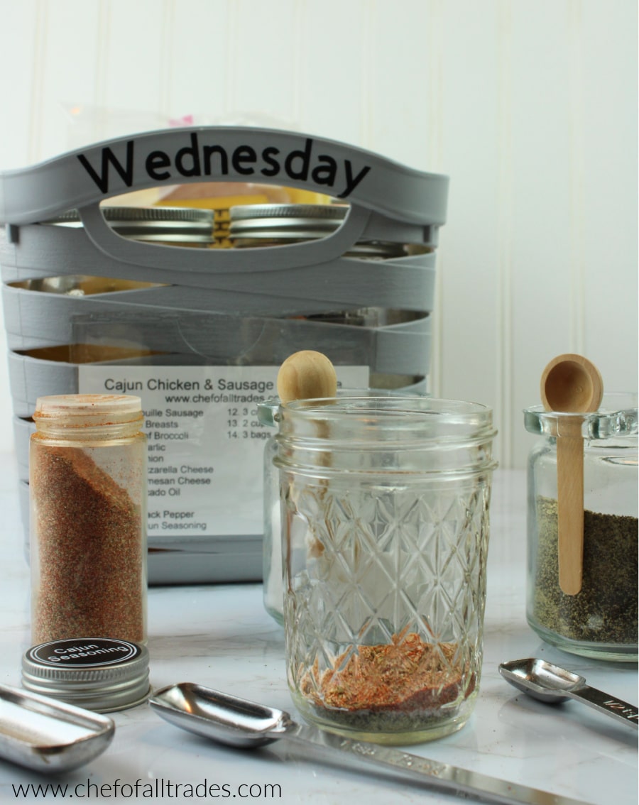 spices being added to a mason jar