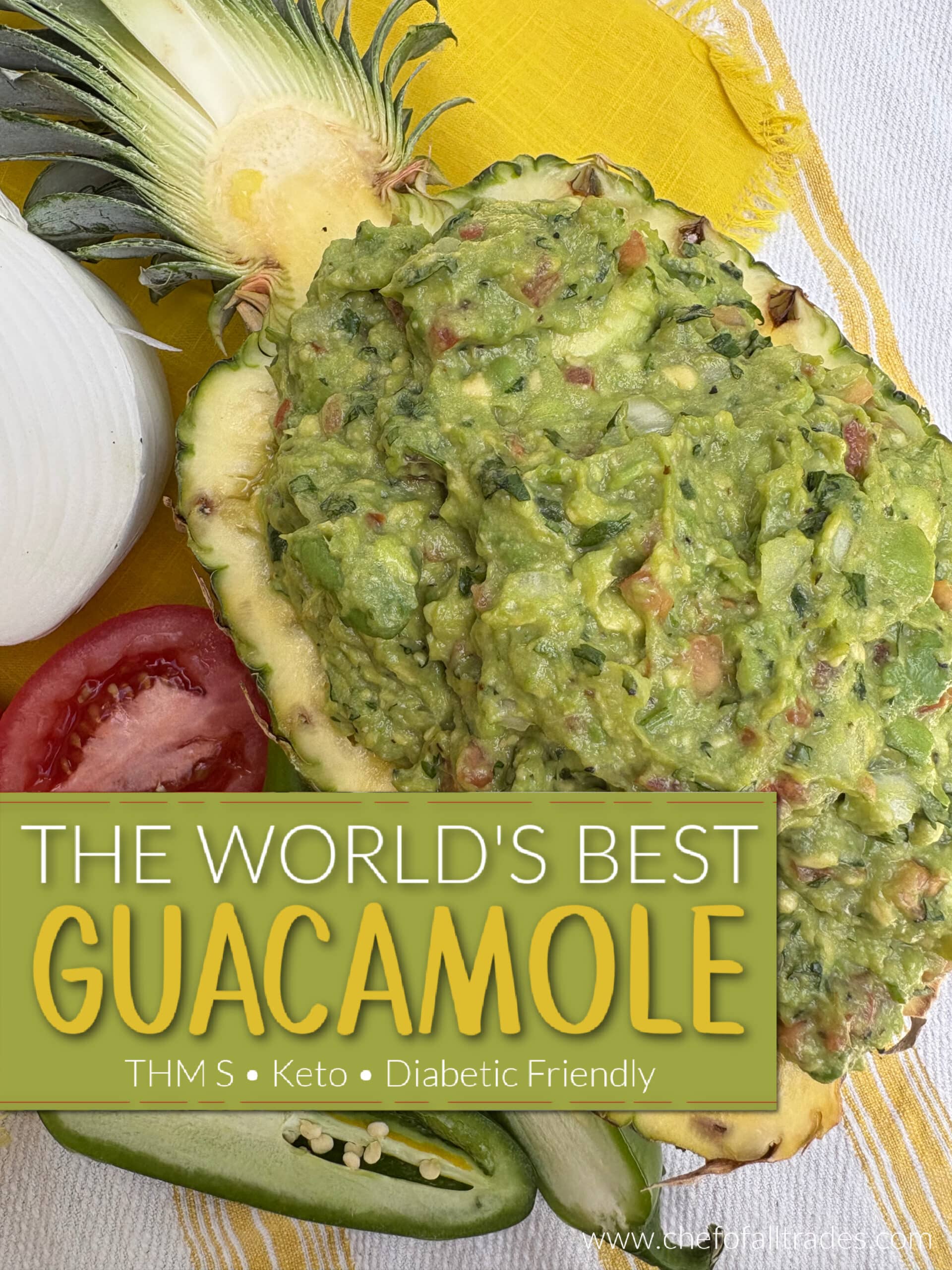 Guacamole in a hollowed out pineapple with the ingredients for guacamole surrounding the pineapple